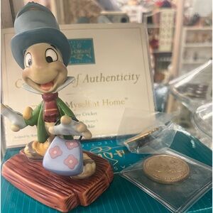 Disney Jiminy, cricket, coin, pin, and certificate, and in new box.